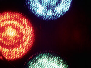 red blue green orbs float on black background
